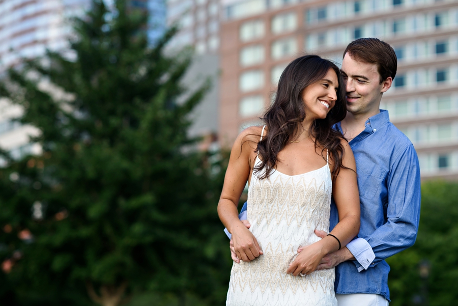 A man telling his fiance he loves her in battery park nyc.